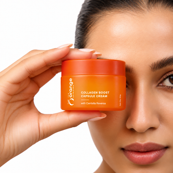 Woman holding Orange Skincare Collagen Boost Capsule Cream with Centella Reversa