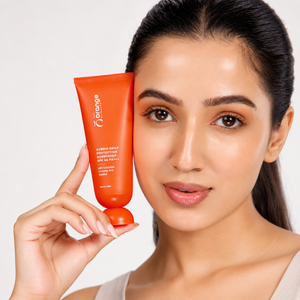 Woman holding Orange Skincare Hybrid Daily Protection Sunscreen SPF 50 PA+++